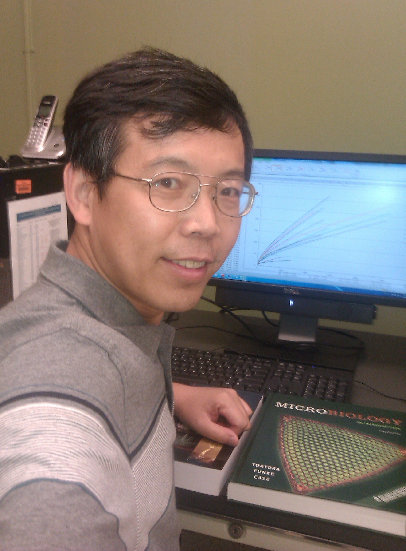 Tiehang Wu analyzes
      soil DNA in his laboratory.